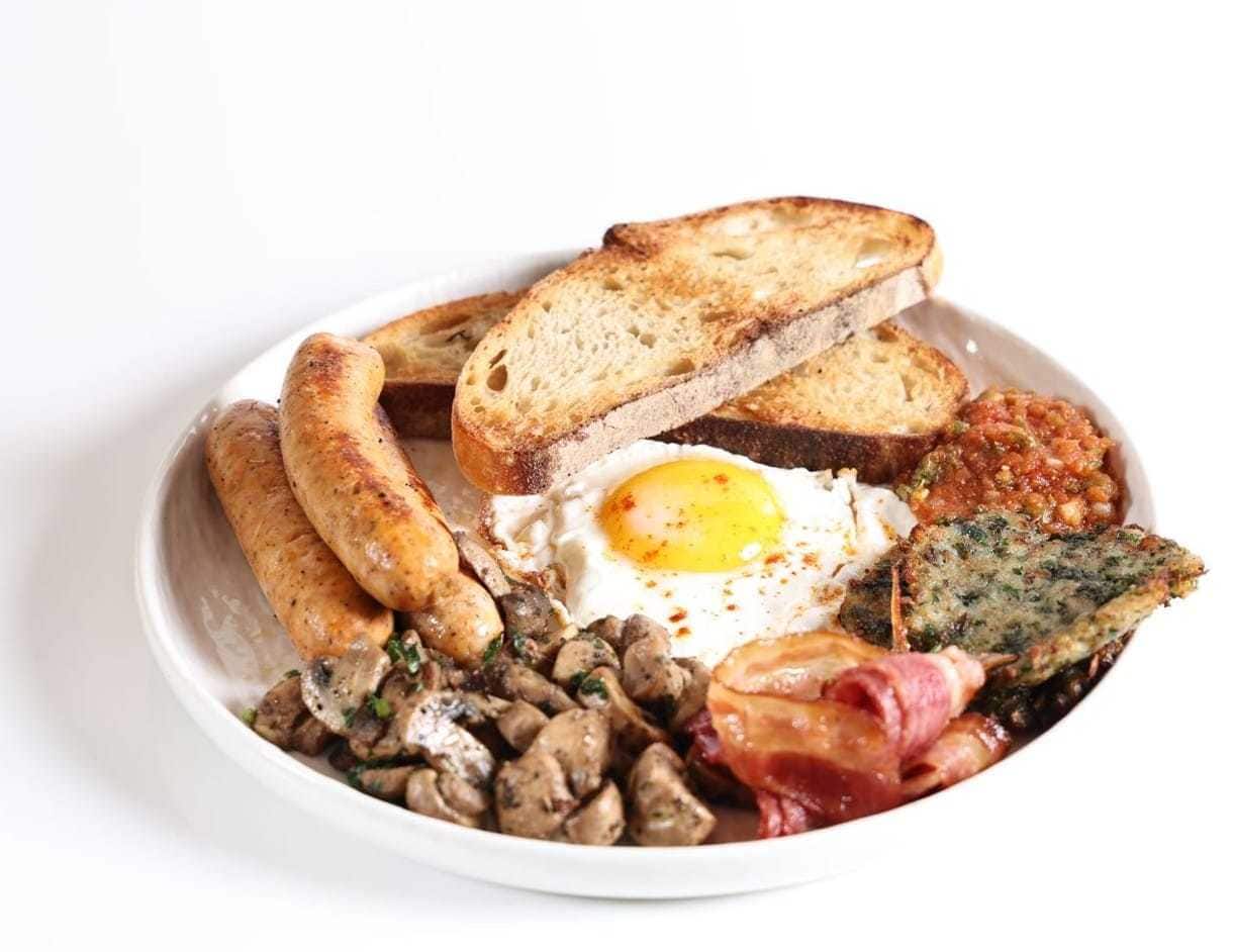 Breakfast plate with egg and sourdough toast at Yellolife Cafe