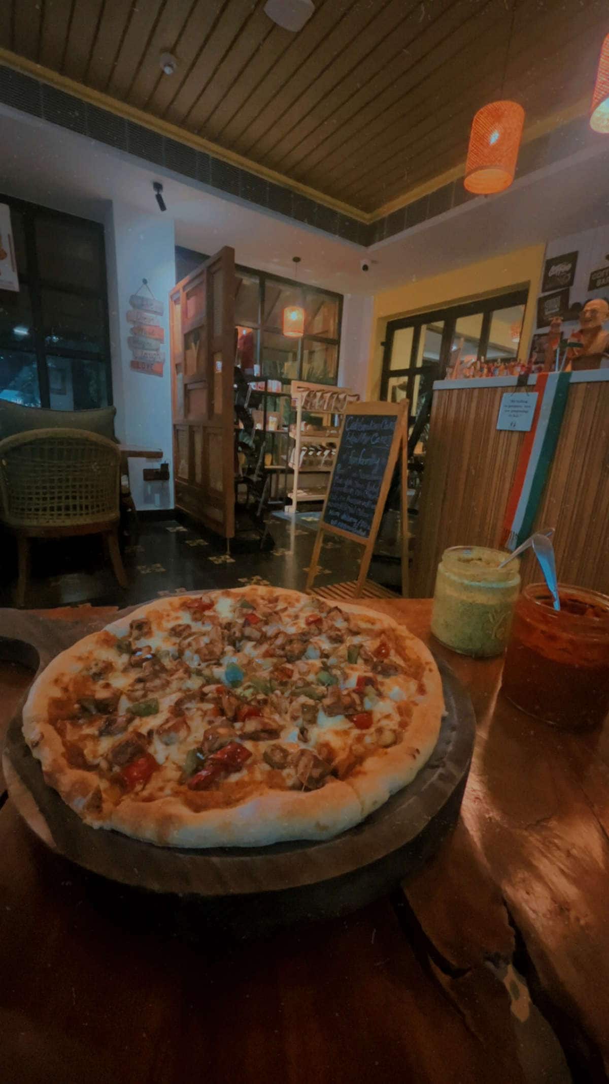 Whole pizza with dips at Yellolife Cafe